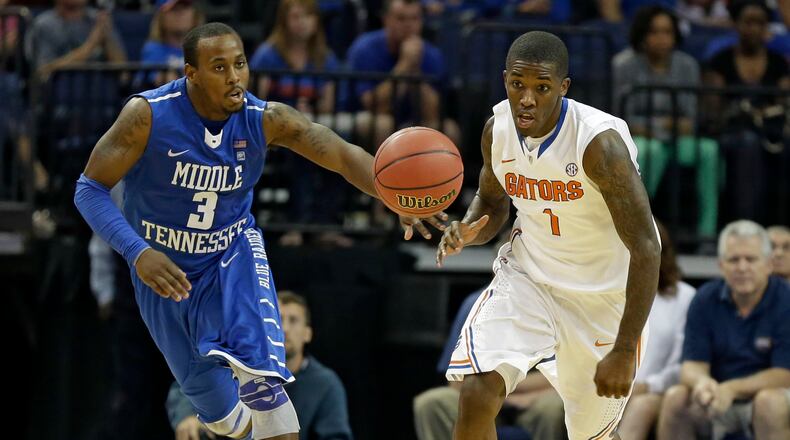 Florida guard Kenny Boynton (1) outruns Middle Tennessee guard James Gallman (3) to the ball during the second half of an NCAA college basketball game Sunday, Nov. 18, 2012, in XXX, Fla. (AP Photo/Chris O'Meara)