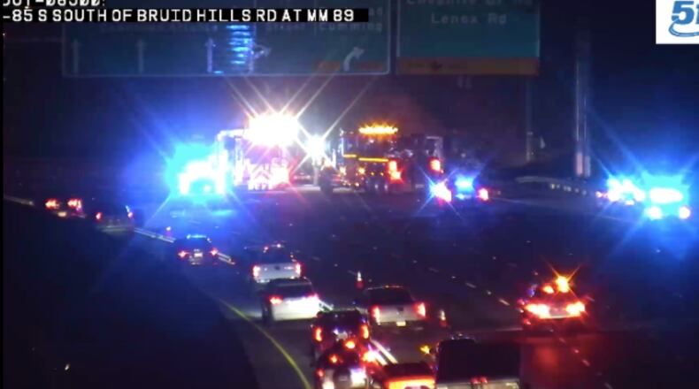 The moving truck overturned on I-85 near the Cheshire Bridge Road exit.