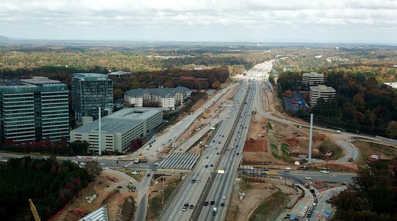 View looks north along Ga. 400 at Abernathy Road in Sandy Springs. A new exit ramp from the southbound expressway to Abernathy takes shape in this aerial view from November, 2020.