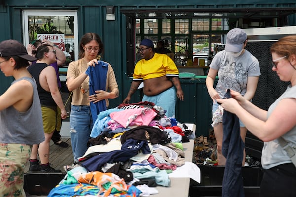 Webb is active in the LGBTQ+ community. Here he helps volunteers sort clothing for Queer Threads, a pop-up thrift shop put on by Southern Fried Queer Pride. 
