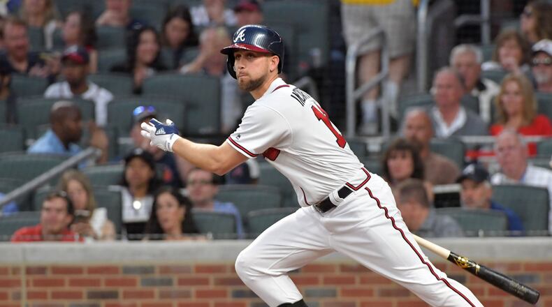 Braves center fielder Ender Inciarte hits a single in the first inning of the Braves home opener on Friday. HYOSUB SHIN / HSHIN@AJC.COM