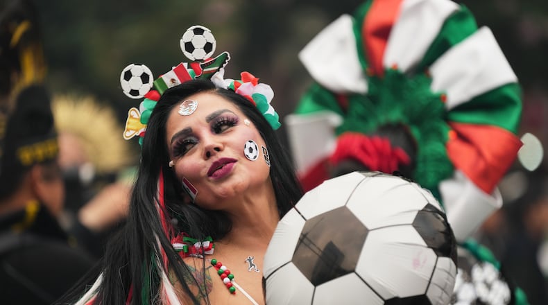 A dancer performs along Reforma Avenue in Mexico City, Saturday, June 6, 2026 ahead of the FIFA World Cup. (AP Photo/Moises Castillo)