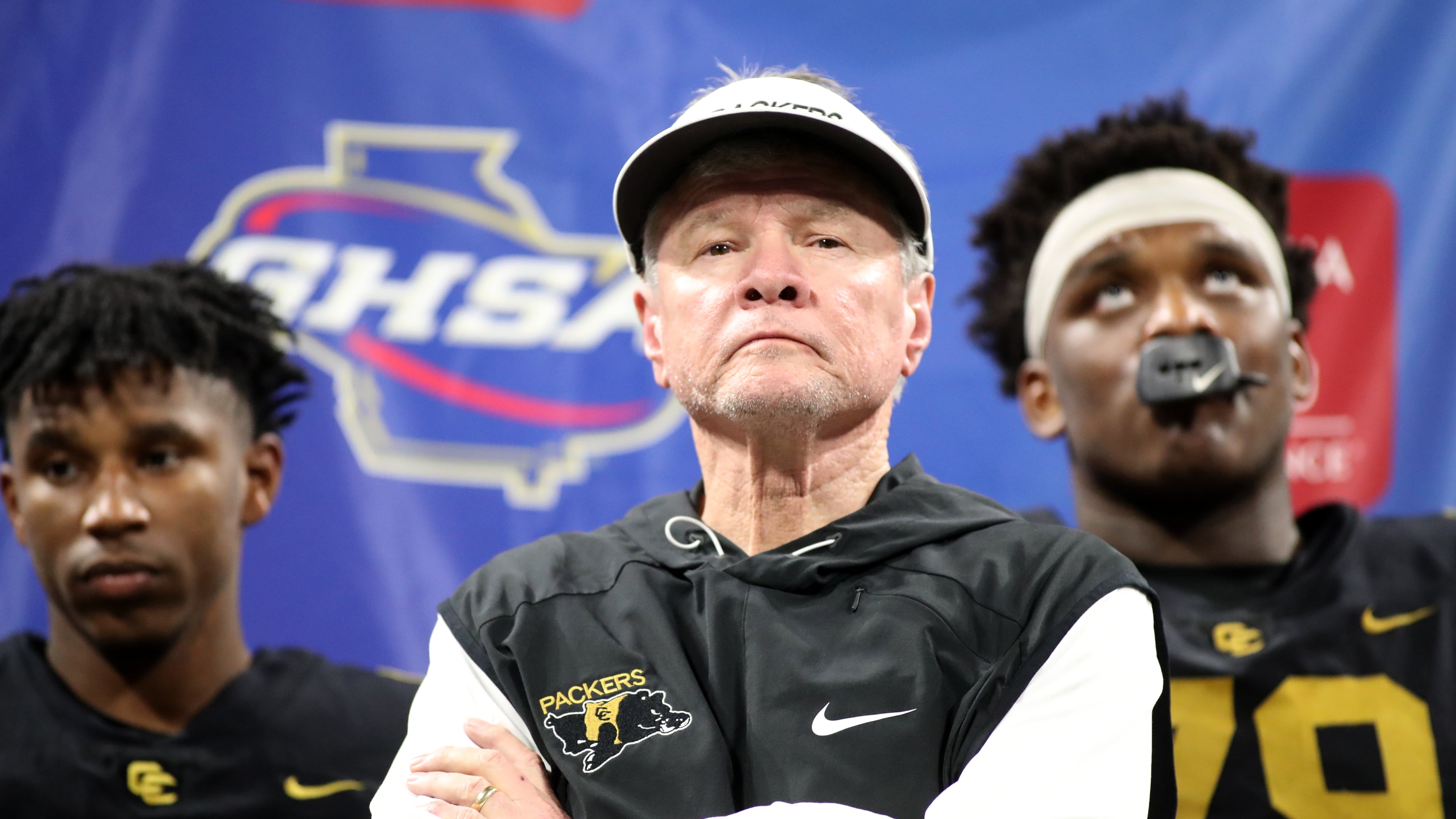 Then-Colquitt County coach Rush Propst receives the runner-up trophy against Milton in the 2018 state championship. (Jason Getz/AJC 2018)