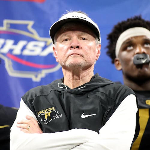Then-Colquitt County coach Rush Propst receives the runner-up trophy against Milton in the 2018 state championship. (Jason Getz/AJC 2018)