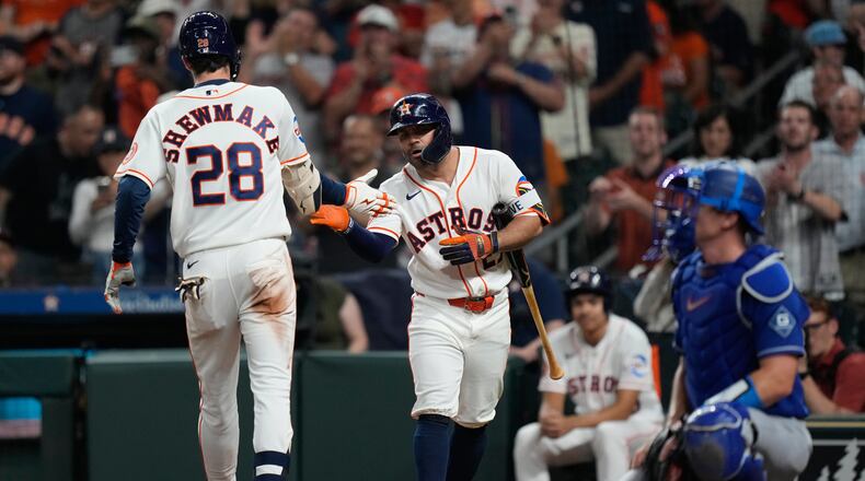 Houston Astros' Braden Shewmake (28) celebrates with Jose Altuve after hitting a home run during the third inning of a baseball game against the Los Angeles Dodgers in Houston, Tuesday, May 5, 2026. (AP Photo/Ashley Landis)