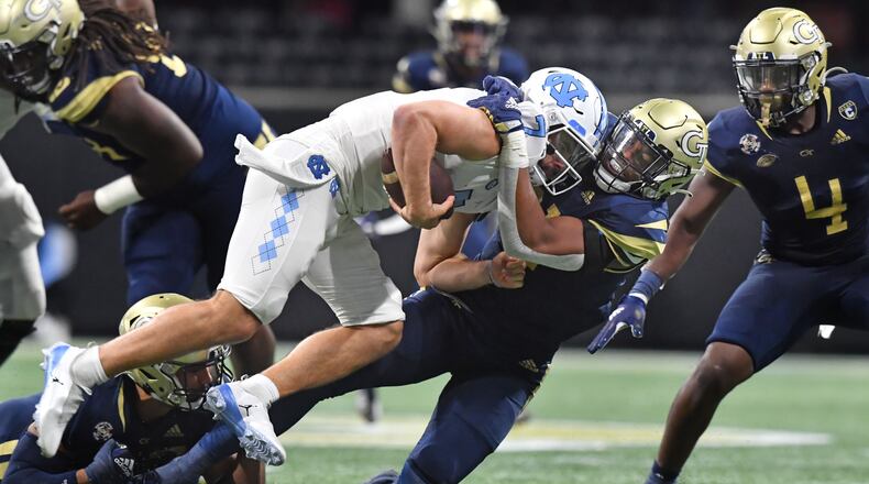 September 25, 2021 Atlanta - North Carolina's quarterback Sam Howell (7) is sacked by Georgia Tech's defensive lineman Kyle Kennard (31) during the second half of an NCAA college football game at Mercedes-Benz Stadium in Atlanta on Saturday, September 25, 2021. Georgia Tech won 45-22 over North Carolina. (Hyosub Shin / Hyosub.Shin@ajc.com)