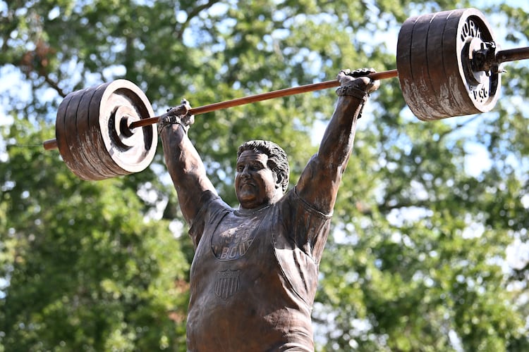 The life-size bronze statue of Paul Anderson in Toccoa, Georgia, took flight after a fourth-grade class wanted to honor "the world's strongest man" in his hometown. (Hyosub Shin/AJC)