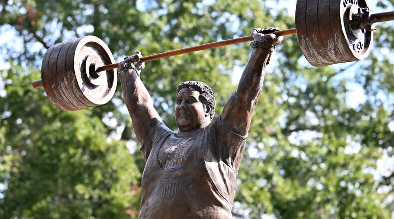 The life-size bronze statue of Paul Anderson in Toccoa, Georgia, took flight after a fourth-grade class wanted to honor "the world's strongest man" in his hometown. (Hyosub Shin/AJC)