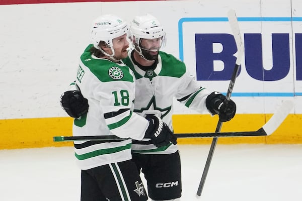 Dallas Stars center Colin Blackwell, right, celebrates his goal with Sam Steel (18) against the Detroit Red Wings in the second period of an NHL hockey game Monday, April 14, 2025, in Detroit. (AP Photo/Paul Sancya)