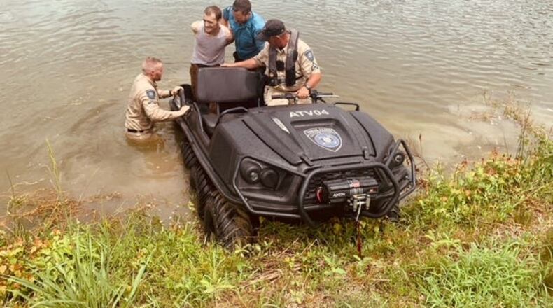 The Chatham County Police Department’s Marine Patrol Unit deployed its amphibious vehicle on to the pond to remove suspect Billy Sloan, 29, from the water.