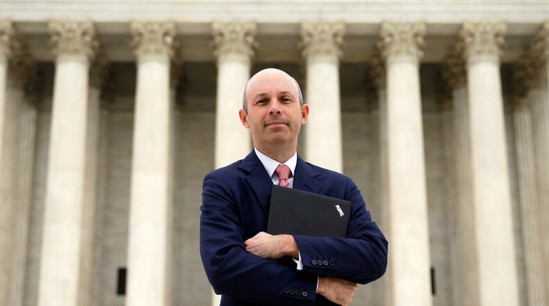 FILE - Tom Goldstein, who writes SCOTUSblog.com, poses for a photograph in front of the Supreme Court, Oct. 31, 2013, in Washington. (AP Photo/Alex Brandon, File)