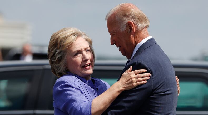 Democratic presidential candidate Hillary Clinton greets Vice President Joe Biden on the tarmac at Wilkes-Barre/Scranton International Airport in Avoca, Pa., on Aug. 15, 2016, before traveling together to a campaign event in Scranton, Pa.