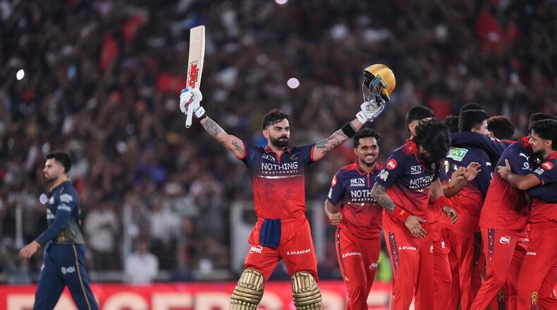 Royal Challengers Bengaluru's Virat Kohli celebrates with teammates after their win in the Indian Premier League final cricket match against Gujarat Titans in Ahmedabad, India, Sunday, May 31, 2026. (AP Photo/Ajit Solanki)