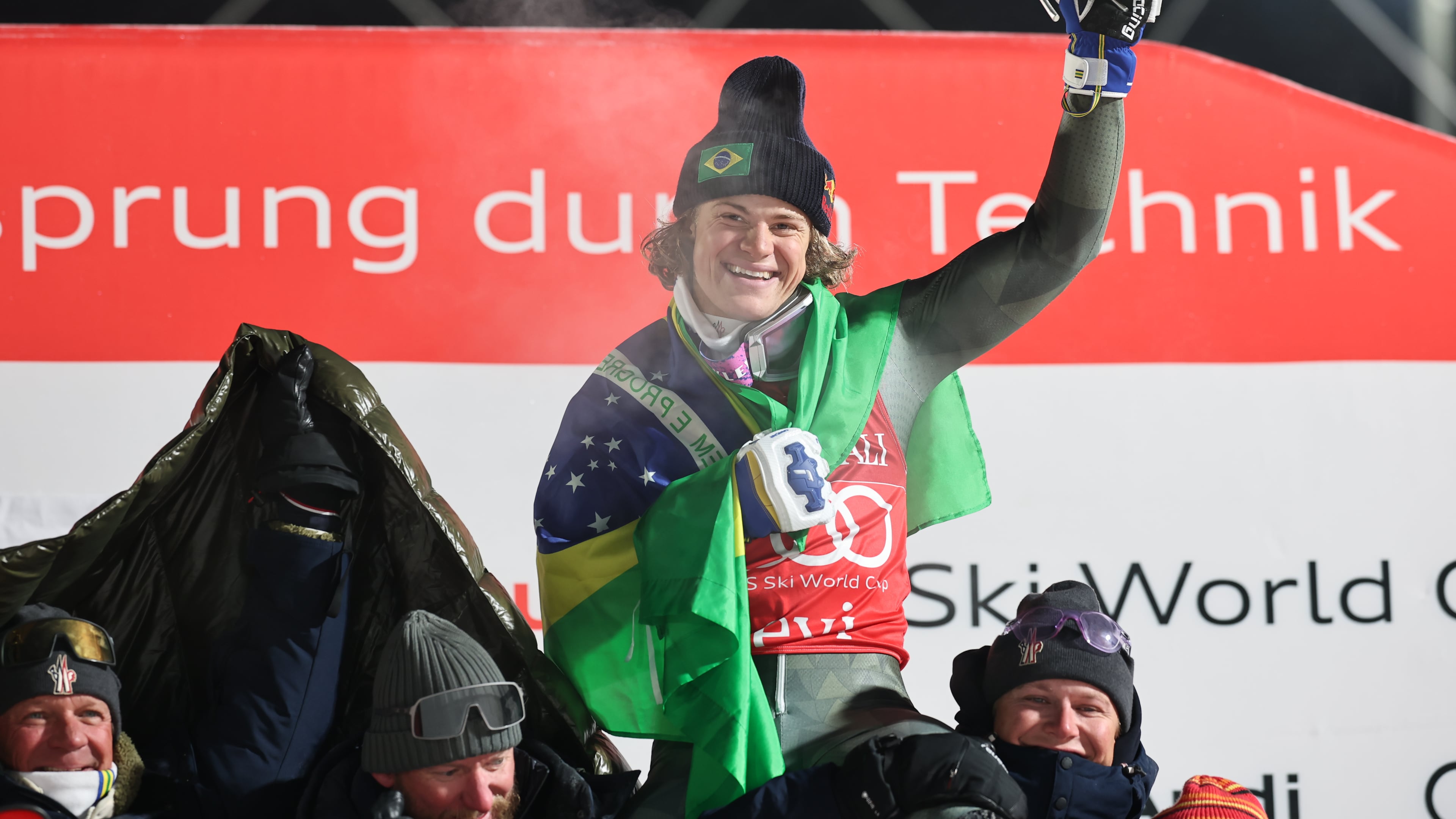 Brazil's Lucas Pinheiro Braathen celebrates with the Brazilian team after winning an alpine ski, men's World Cup slalom, in Levi, Finland, Sunday, Nov. 16, 2025. (AP Photo/Marco Trovati)