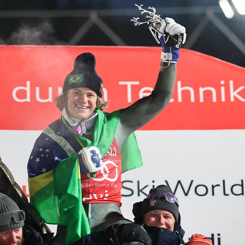 Brazil's Lucas Pinheiro Braathen celebrates with the Brazilian team after winning an alpine ski, men's World Cup slalom, in Levi, Finland, Sunday, Nov. 16, 2025. (AP Photo/Marco Trovati)