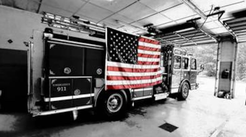 With his new specialized glasses given to him by his fellow firefighters, Douglas County Firefighter Spencer Caradine now can see colors - most wanting to see those of the American flag. (Courtesy of Douglas County Fire Department/Jerry Stephens)