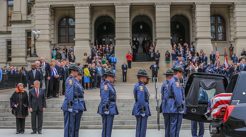 Gov. Nathan Deal and Sandra Deal looked on as the casket of Zell Miller, the former Georgia governor and U.S. senator who died Friday at age 86, arrived at the State Capitol on Tuesday afternoon. He will lie in state until an executive state funeral Wednesday.