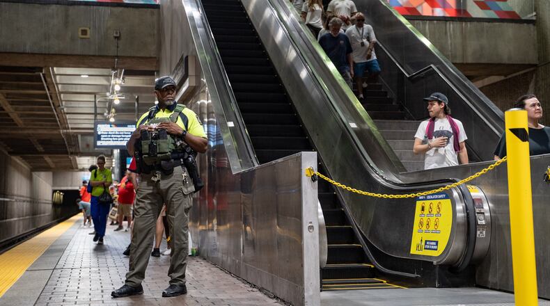 A MARTA Police officer stands on the platform of the SEC District MARTA station as fans attend the first FIFA match held in Atlanta on Monday, June 15, 2026. Recent violence on trains, including a stabbing, heightened safety concerns. (Ben Hendren for the AJC)