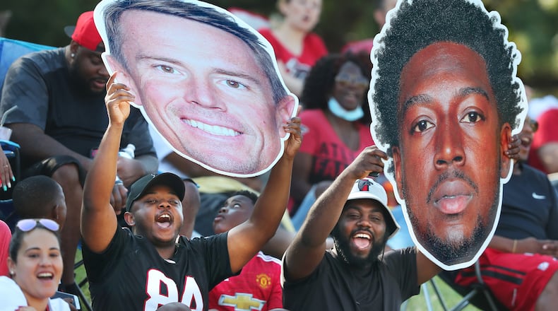 Falcons fans cheer for Matt Ryan and Calvin Ridley from the hill overlooking the practice fields during the fourth day of training camp practice Aug. 1 in Flowery Branch. (Curtis Compton / Curtis.Compton@ajc.com)