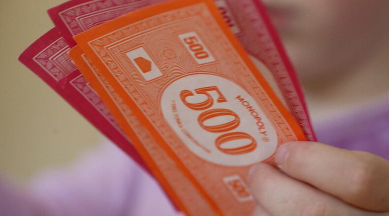 FILE PHOTO: Monopoly is getting a big update. "Ms. Monopoly" will have female players earning more money than male counterparts.