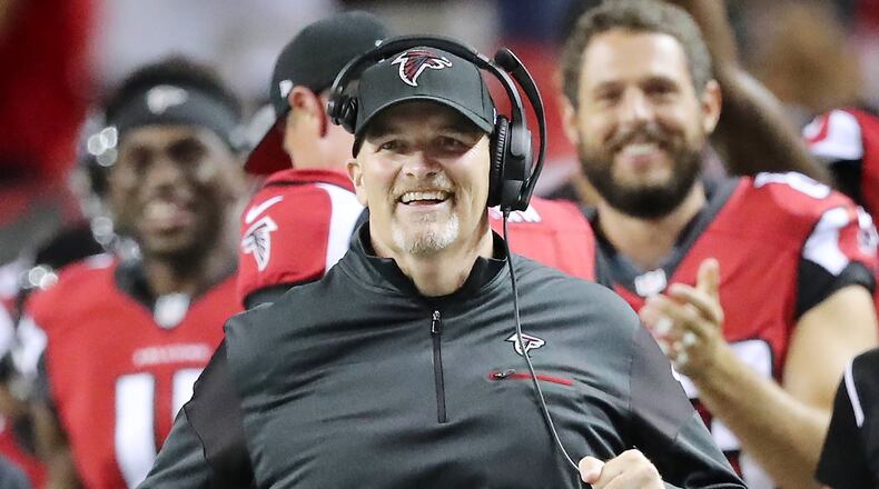 Falcons coach Dan Quinn is all smiles running down the sidelines during a 23-17 victory over the Redskins in an NFL preseason football game Thursday, August 11, 2016, in Atlanta. Curtis Compton /ccompton@ajc.com