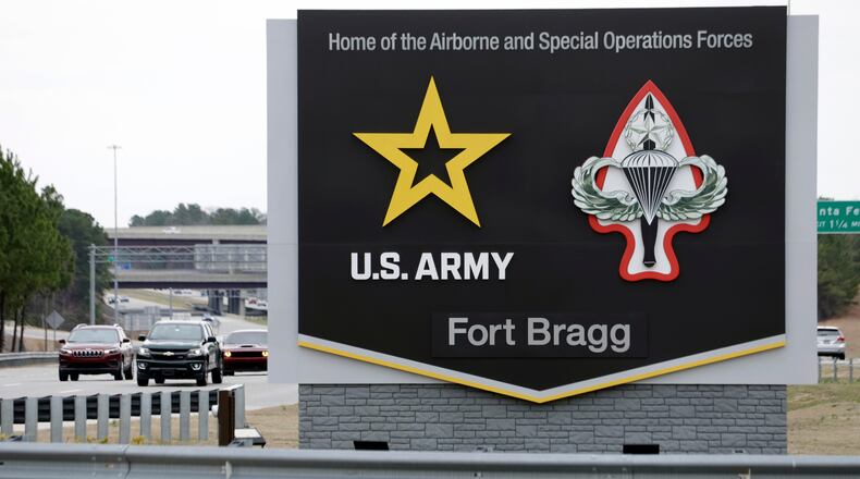 FILE - A sign for Fort Bragg is seen, March 7, 2025, in Fort Bragg, N.C. (AP Photo/Chris Seward, File)