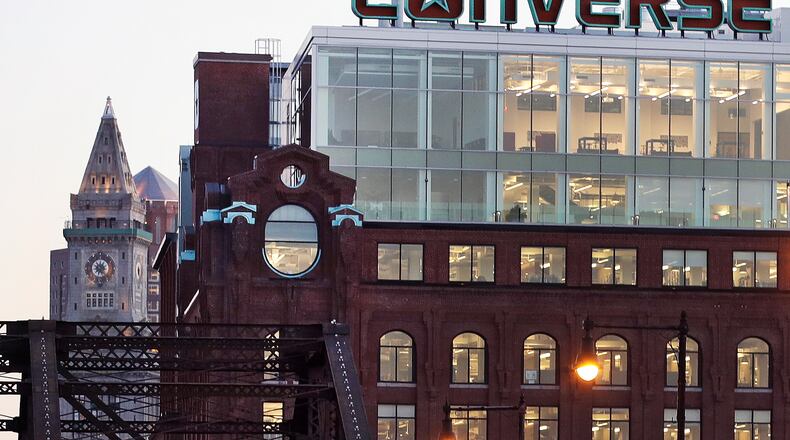 FILE - The Converse logo is displayed on the roof of the company's world headquarters in the West End neighborhood of Boston, Wednesday, Dec. 28, 2016. (AP Photo/Charles Krupa, file)