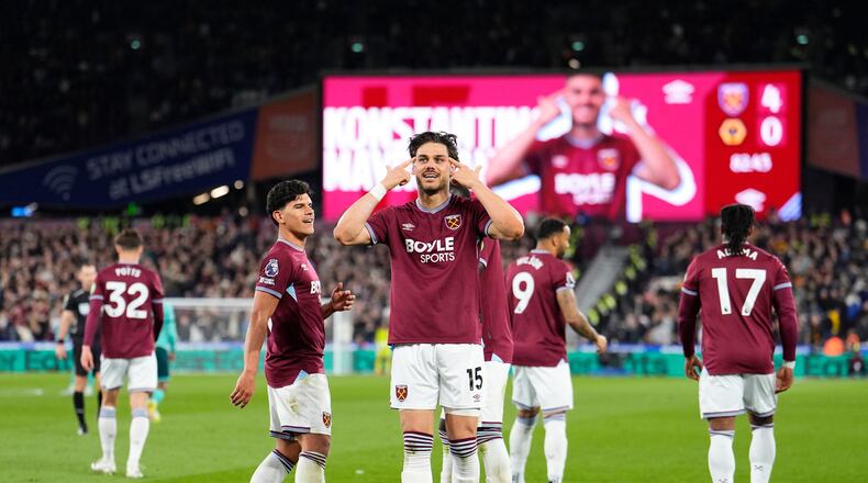 West Ham United's Konstantinos Mavropanos celebrates scoring their side's fourth goal of the game during their English Premier League soccer match against Wolverhampton Wanderers in London, Friday, April 10, 2026. (Jordan Pettitt/PA via AP)