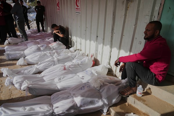 Palestinians mourn their relatives killed in an Israeli airstrikes in Jabalia, northern Gaza Strip, on Wednesday, May 14, 2025. According to local hospitals, 48 people were killed in the strikes, including 22 children. (AP Photo/Jehad Alshrafi)