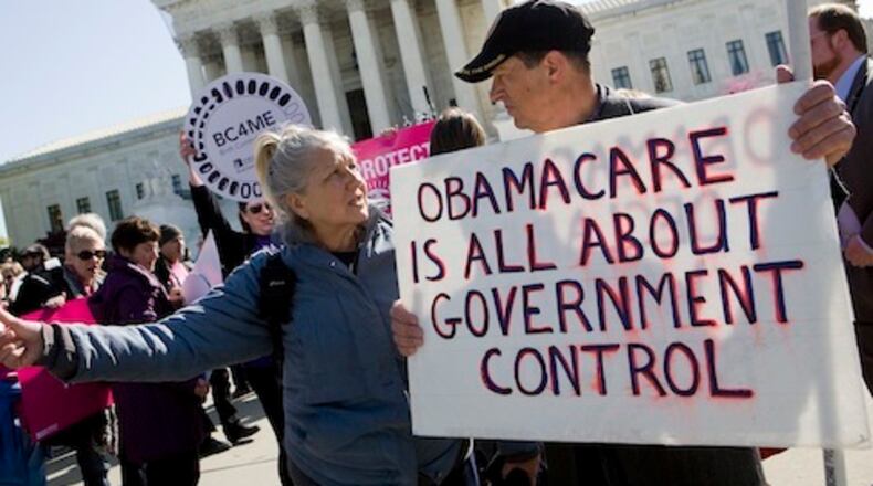 27 March 2012 – Washington, D.C. – Protestors for and against President Barack Obama’s healthcare reform law rally in front of the Supreme Court building in downtown Washington. The court is currently hearing testimony on the legality of the law and will rule on its constitutionality in June. Photo Credit: Kristoffer Tripplaar/ Sipa USA (Sipa via AP Images)