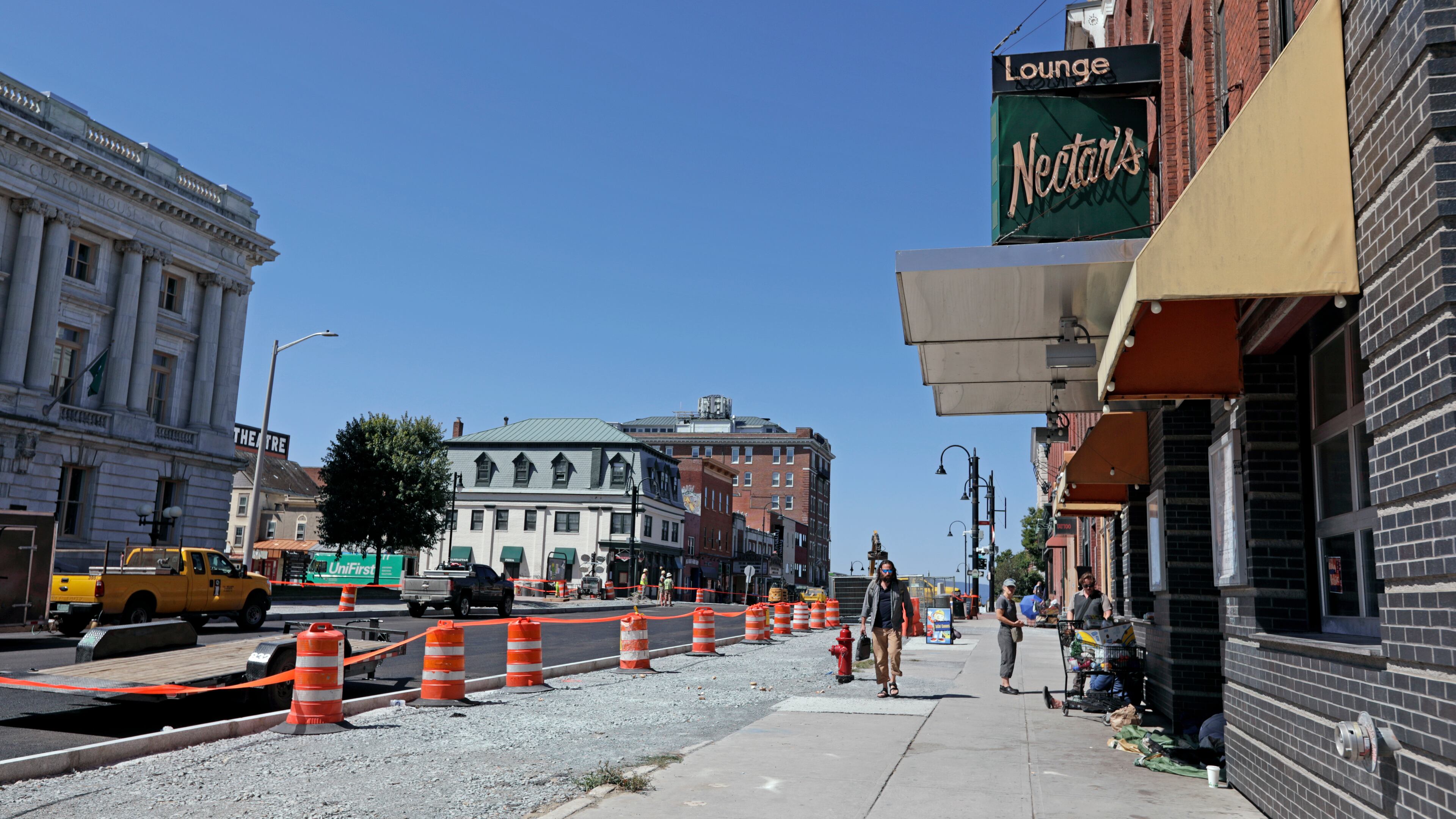People walk by Nectar's, the music club where jam band Phish got their start, in downtown Burlington, Vt., Wednesday, July 30, 2025. (AP Photo/Amanda Swinhart)