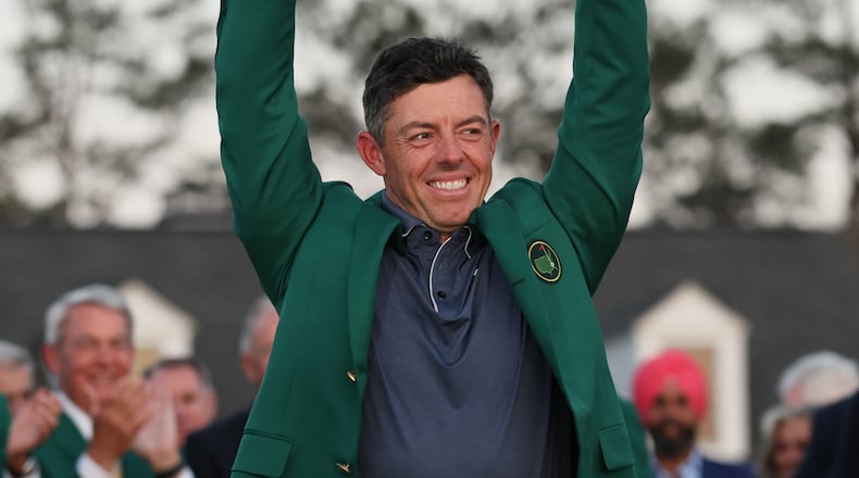 Rory McIlroy celebrates winning the Masters golf tournament at Augusta National Golf Club, Sunday, April 13, 2025, in Augusta, Ga.  (Jason Getz / AJC)