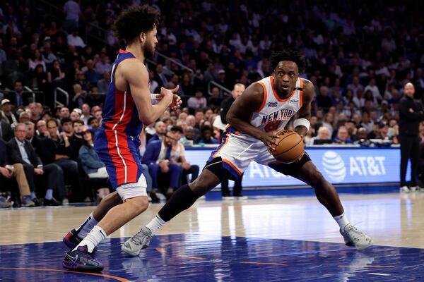 New York Knicks forward OG Anunoby (8) drives to the basket past Detroit Pistons guard Cade Cunningham during Game 5 in an NBA basketball first-round playoff series Tuesday, April 29, 2025, in New York. (AP Photo/Adam Hunger)