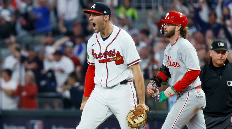 Atlanta Braves first baseman Matt Olson reacts after forcing out Philadelphia Phillies’ Bryce Harper at first base on a fly out by Nick Castellanos to end the ninth inning of NLDS Game 2 in Atlanta on Monday, Oct. 9, 2023. (Miguel Martinez / Miguel.Martinezjimenez@ajc.com)