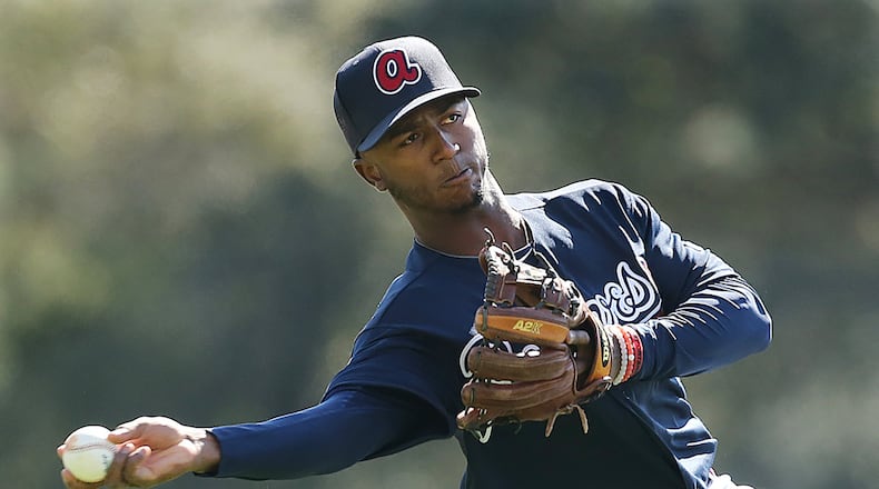 Braves second-base prospect Ozzie Albies, pictured here during a workout at 2016 spring training, is a little behind other players this spring as he recovers from September surgery for a broken elbow. (Curtis Compton / ccompton@ajc.com)