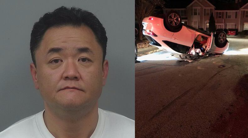 Kyu Jin Lim, 46, was charged with DUI, reckless driving, driving too fast for conditions and improper lane change after his car allegedly clipped a parked vehicle and flipped over in a Duluth neighborhood.