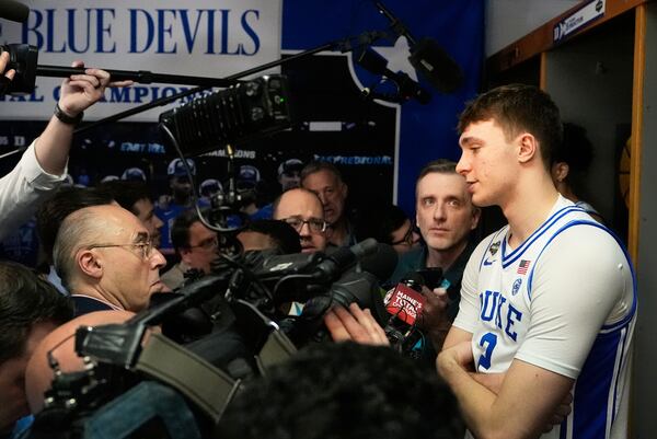 Duke forward Cooper Flagg is interviewed in the locker room during media day at the Final Four of the NCAA college basketball tournament, Thursday, April 3, 2025, in San Antonio. (AP Photo/Brynn Anderson )