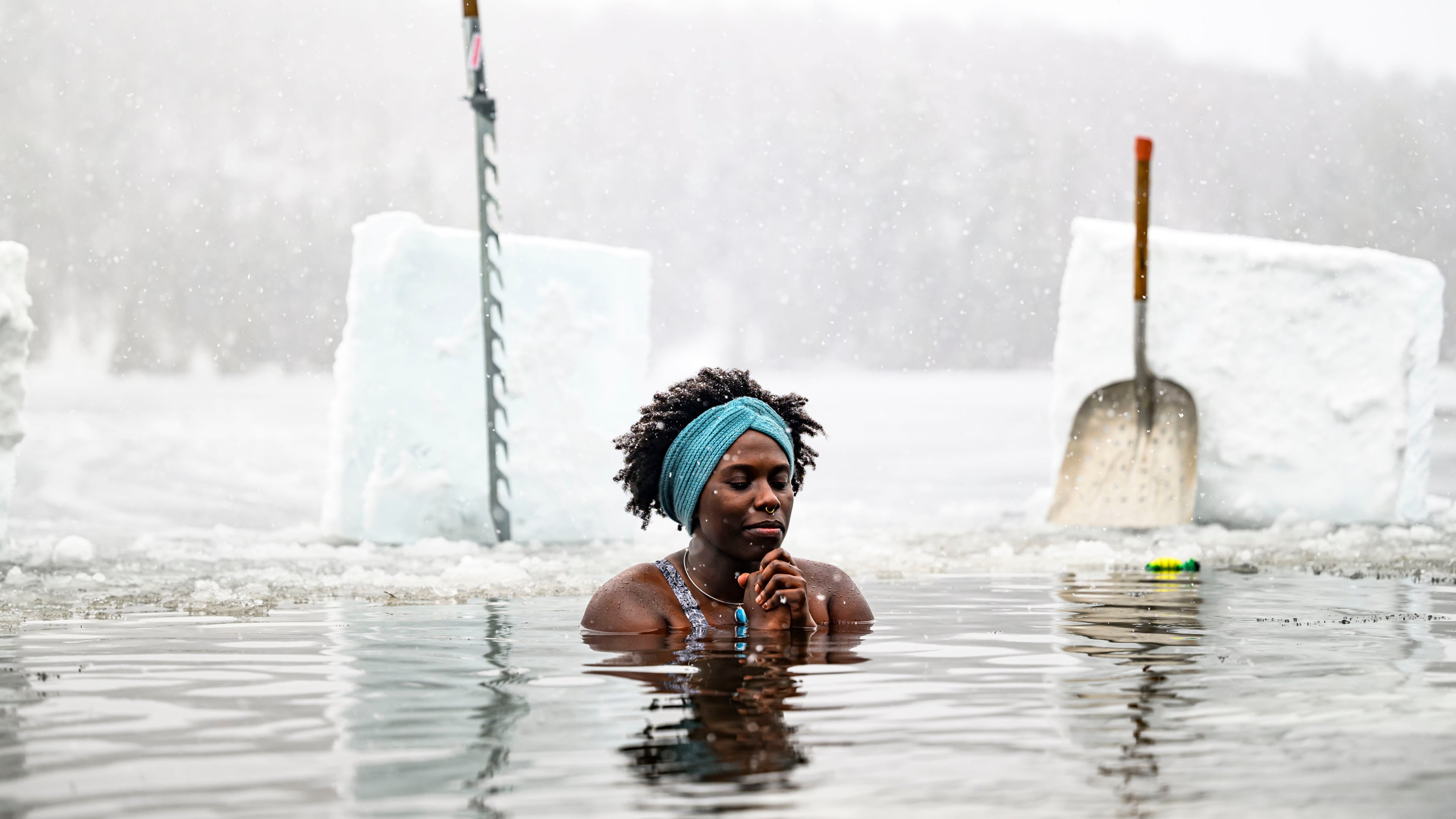 FILE - Canda-Leigh Habonimana dips in the waters of Gatineau Park's Meech Lake in Chelsea, Que., during a polar bear dip on New Year's Day, Jan. 1, 2025. (Justin Tang /The Canadian Press via AP)