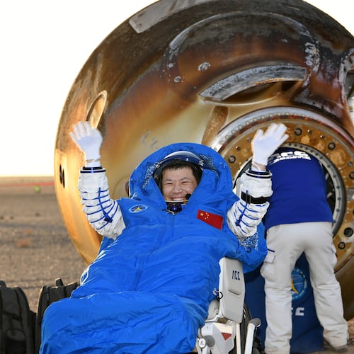 In this photo released by Xinhua News Agency, Wang Jie, a Shenzhou-20 astronaut, returns on the Shenzhou-21 spaceship's return capsule after it touched down on Earth at the Dongfeng landing site in north China's Inner Mongolia Autonomous Region, Friday, Nov. 14, 2025. (Wang Jiangbo/Xinhua via AP)