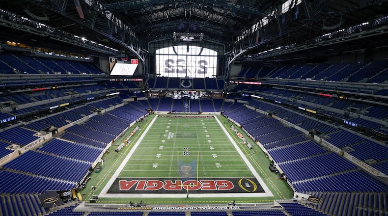 1/9/22 - Indianapolis - Other than the center logo, the field is nearly ready at the 2022 College Football Playoff National Championship between the Georgia Bulldogs and the Alabama Crimson Tide at Lucas Oil Stadium in Indianapolis on Sunday, January 9, 2022. Bob Andres / robert.andres@ajc.com