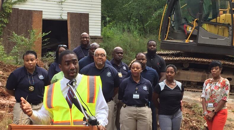 DeKalb interim CEO Lee May addresses the media before demolishing a fire-damaged home in Stone Mountain Thursday, Aug. 4, 2016.