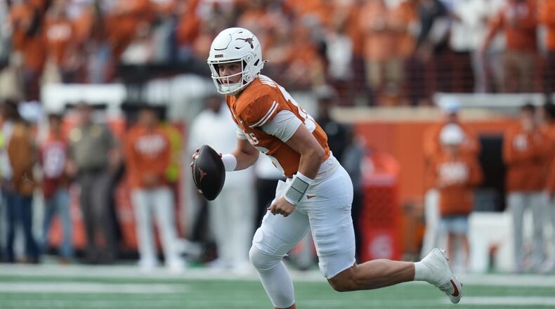 Texas quarterback Arch Manning (16) runs as he looks to throw against Vanderbilt during the first half of an NCAA college football game in Austin, Texas, Saturday, Nov. 1, 2025. (AP Photo/Eric Gay)
