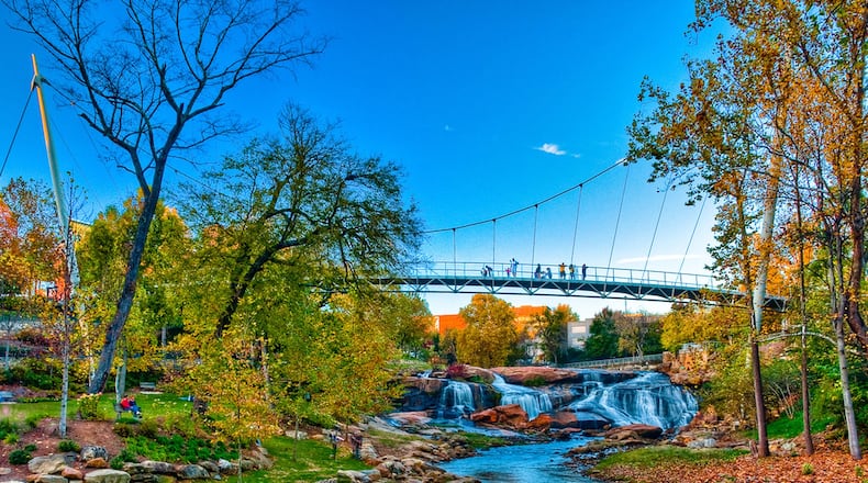 The pedestrian Liberty Bridge crosses the Reedy River in Falls Creek Park. CONTRIBUTED BY WWW.SOUTHEASTDISCOVERY.COM