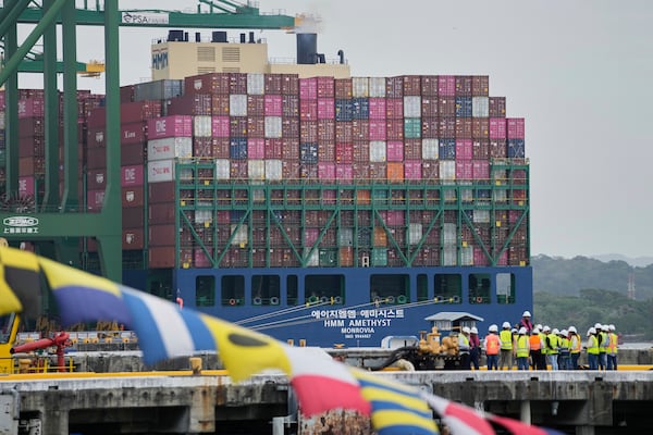 A cargo ship is loaded at the Port of Rodman in West Panama during the visit of U.S. Defense Secretary Pete Hegseth to the Panama Canal, Tuesday, April 8, 2025. (AP Photo/Matias Delacroix)