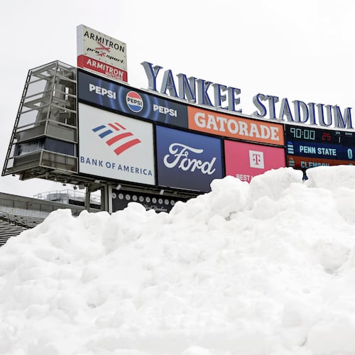 Snow is seen piled up on the field before the Pinstripe Bowl NCAA college football game between Clemson and Penn State at Yankee Stadium Saturday, Dec. 27, 2025, in New York. (AP Photo/Adam Hunger)