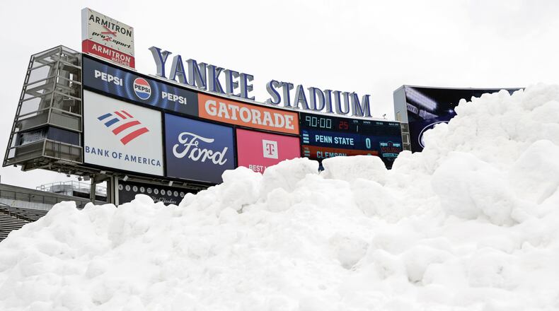 Snow is seen piled up on the field before the Pinstripe Bowl NCAA college football game between Clemson and Penn State at Yankee Stadium Saturday, Dec. 27, 2025, in New York. (AP Photo/Adam Hunger)