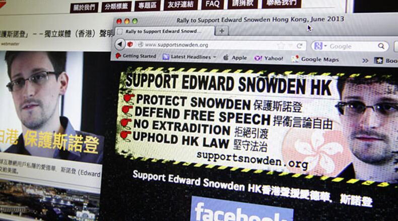 Websites supporting Edward Snowden, former CIA employee who leaked top-secret documents about sweeping U.S. surveillance programs, are displayed on a computer screen in Hong Kong Thursday, June 13, 2013.