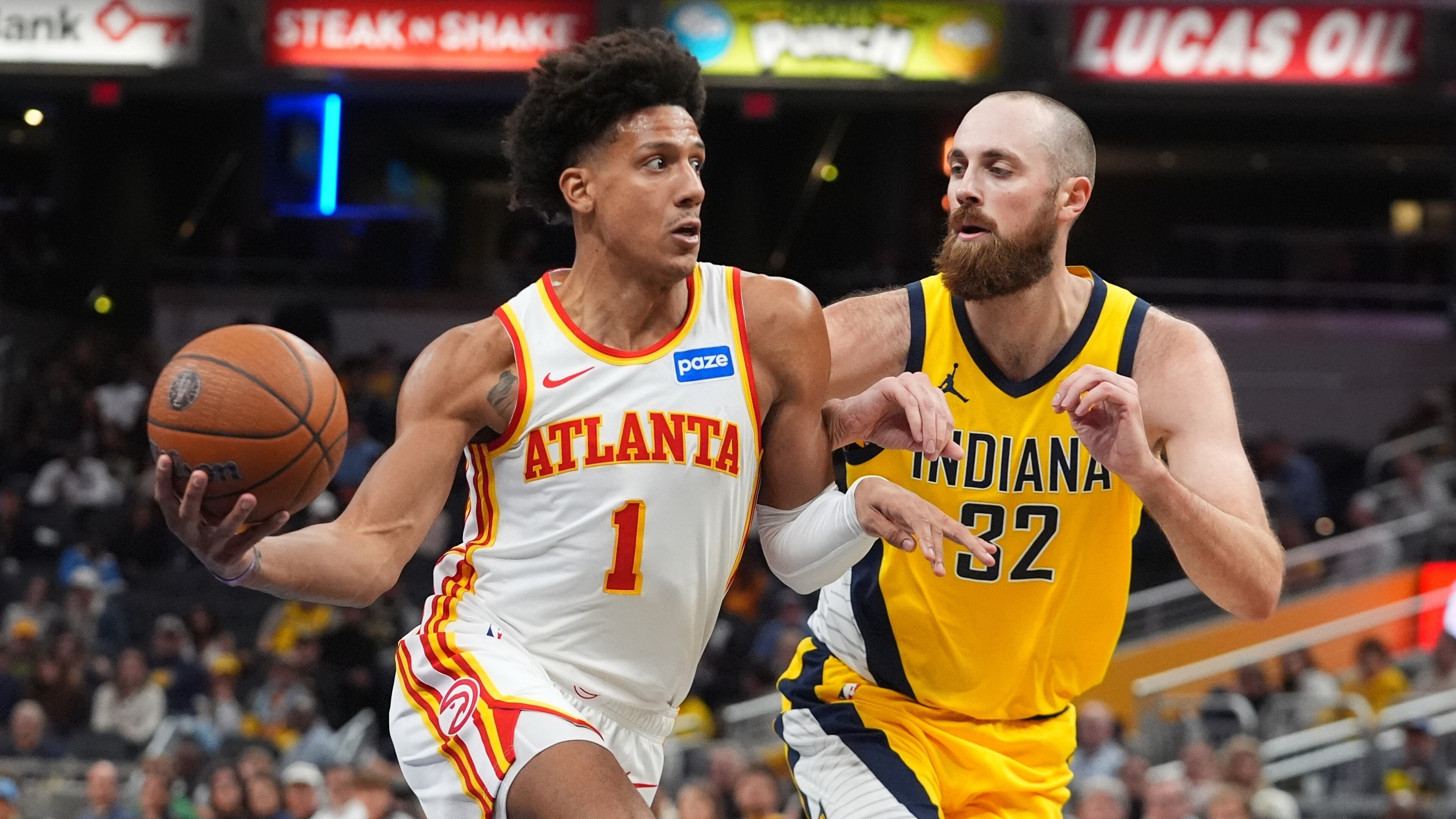 Atlanta Hawks' Jalen Johnson (1) goes to the basket against Indiana Pacers' Jay Huff (32) during the second half of an NBA Cup basketball game, Friday, Oct. 31, 2025, in Indianapolis. (AP Photo/Darron Cummings)