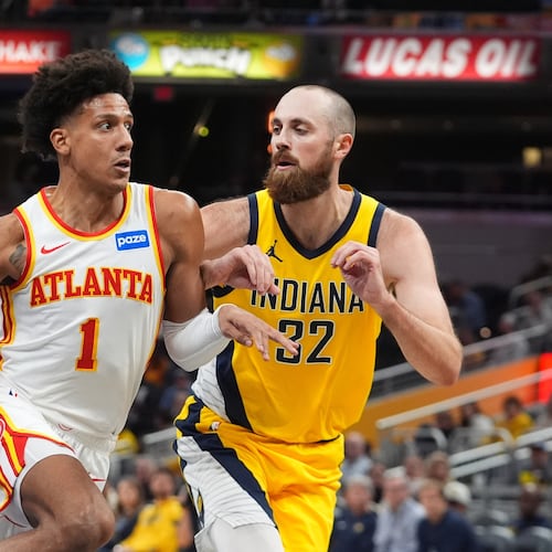Atlanta Hawks' Jalen Johnson (1) goes to the basket against Indiana Pacers' Jay Huff (32) during the second half of an NBA Cup basketball game, Friday, Oct. 31, 2025, in Indianapolis. (AP Photo/Darron Cummings)