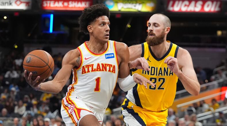 Atlanta Hawks' Jalen Johnson (1) goes to the basket against Indiana Pacers' Jay Huff (32) during the second half of an NBA Cup basketball game, Friday, Oct. 31, 2025, in Indianapolis. (AP Photo/Darron Cummings)